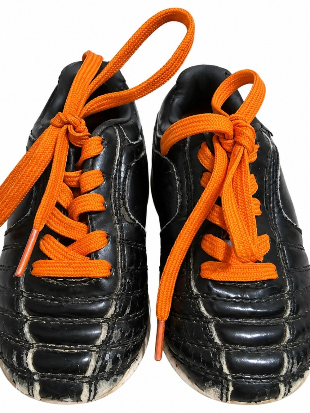 Kids Black Athletic Cleats with Orange Laces
